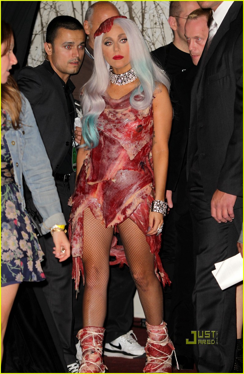 lady gaga red dress eminem Lady Gaga accepts her award from Eminem onstage during the 2009 MTV... News  Photo