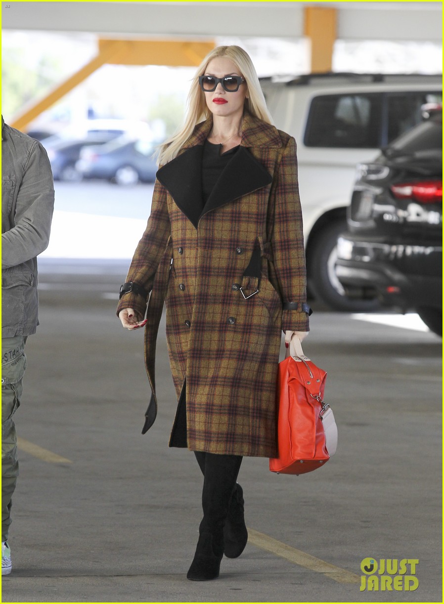 Gwen Stefani Shows Growing Baby Bump in Form-Fitting Shirt