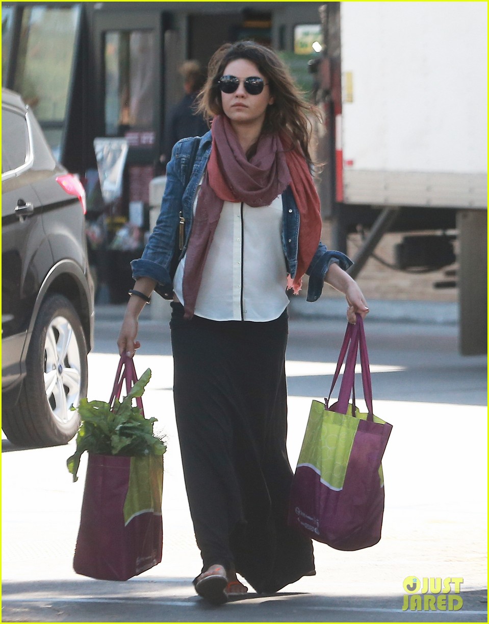 Pregnant Mila Kunis Steps Out with a Tiny Baby Bump