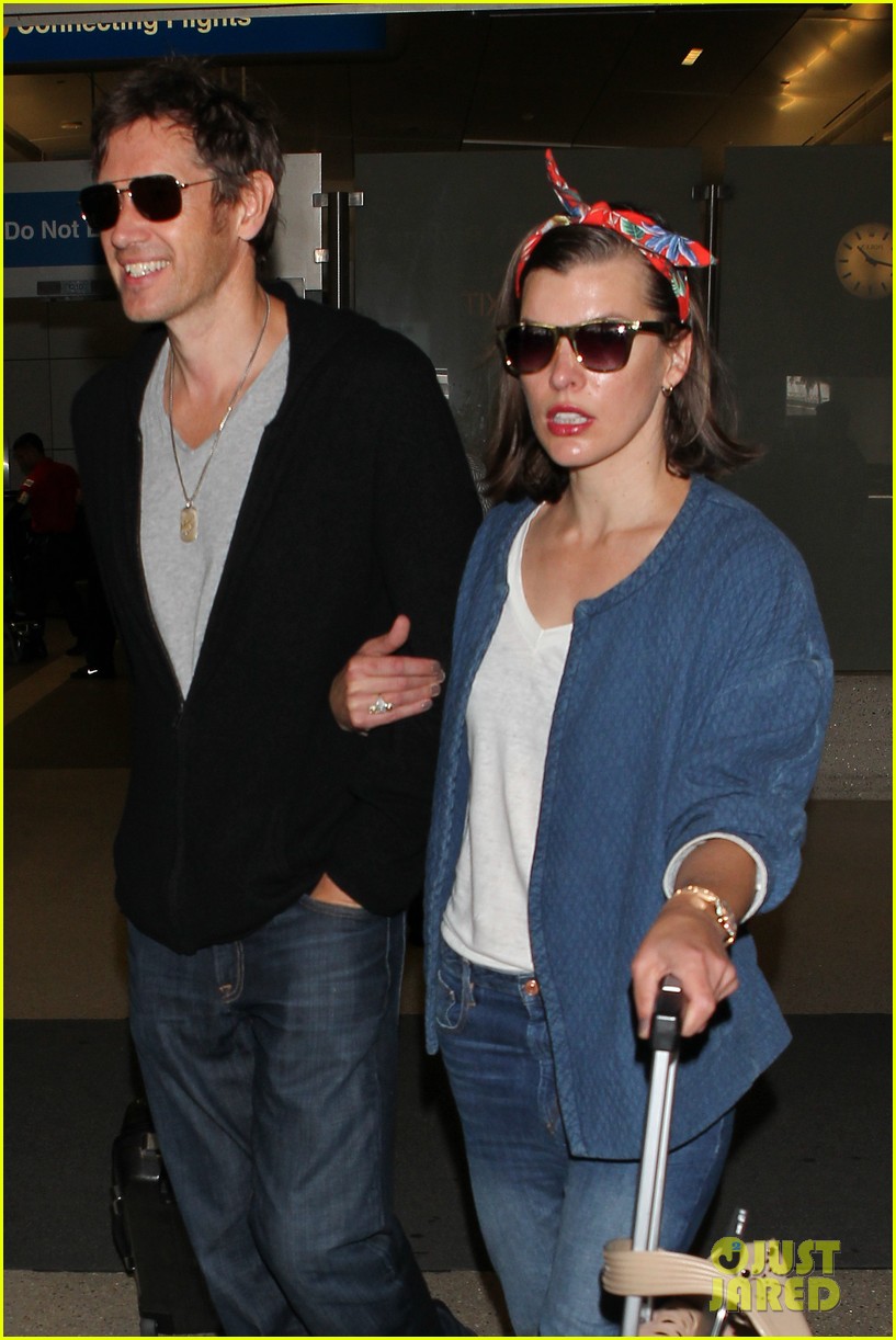 Milla Jovovich & Husband Paul W.S. Anderson Look So in Love at LAX