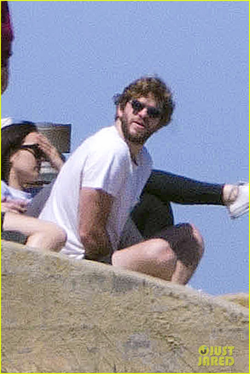 Liam Hemsworth Lounges by the Beach with His Australian Pals