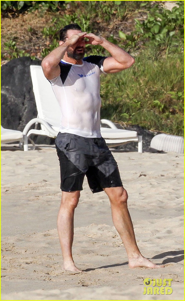 Hugh Jackman's Abs Poke Out of His Wet Shirt at the Beach!