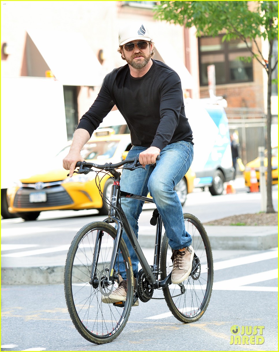 Gerard Butler Enjoys Outdoor Meal & Bike Ride Around NYC