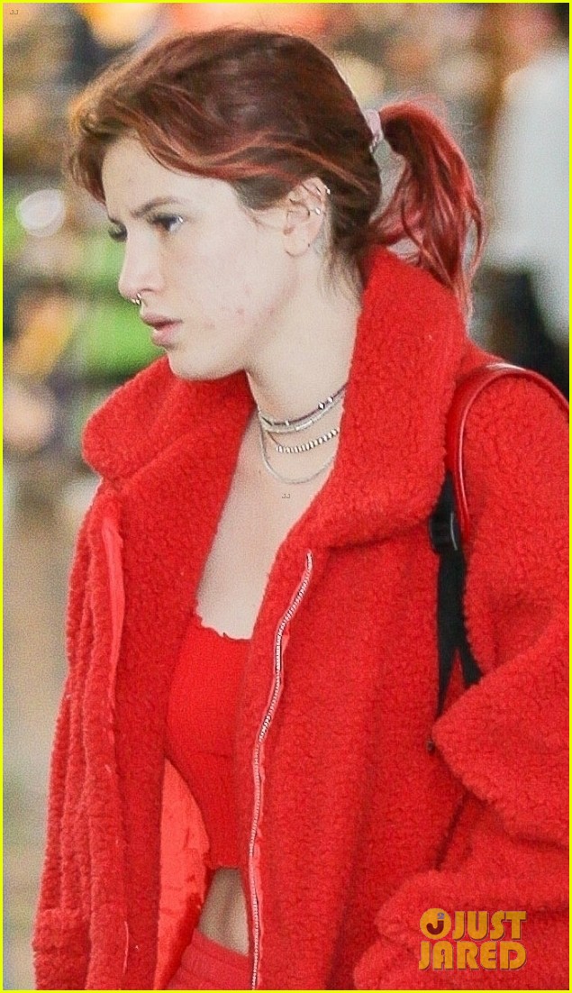 Bella Thorne Rocks a Red Outfit While Arriving at the Airport With Boyfriend Mod Sun