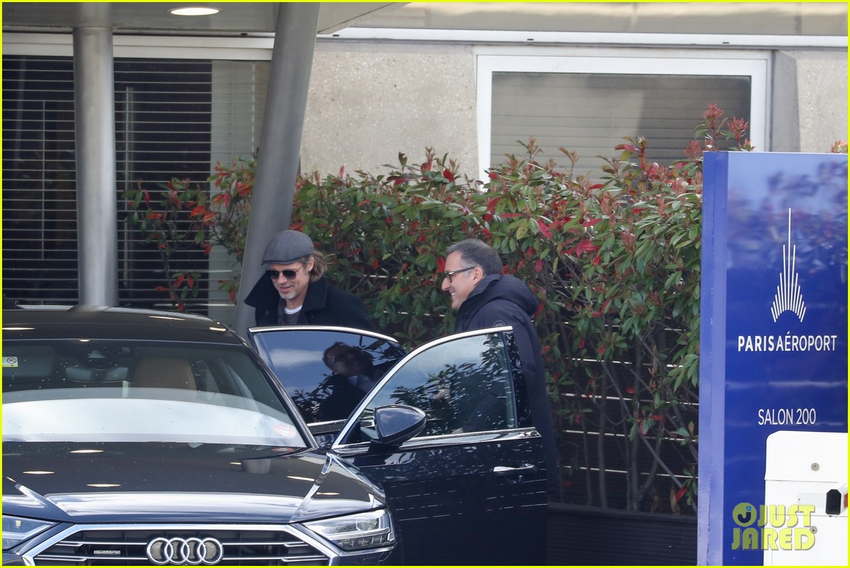 Brad Pitt Flashes a Smile After Arriving in Paris