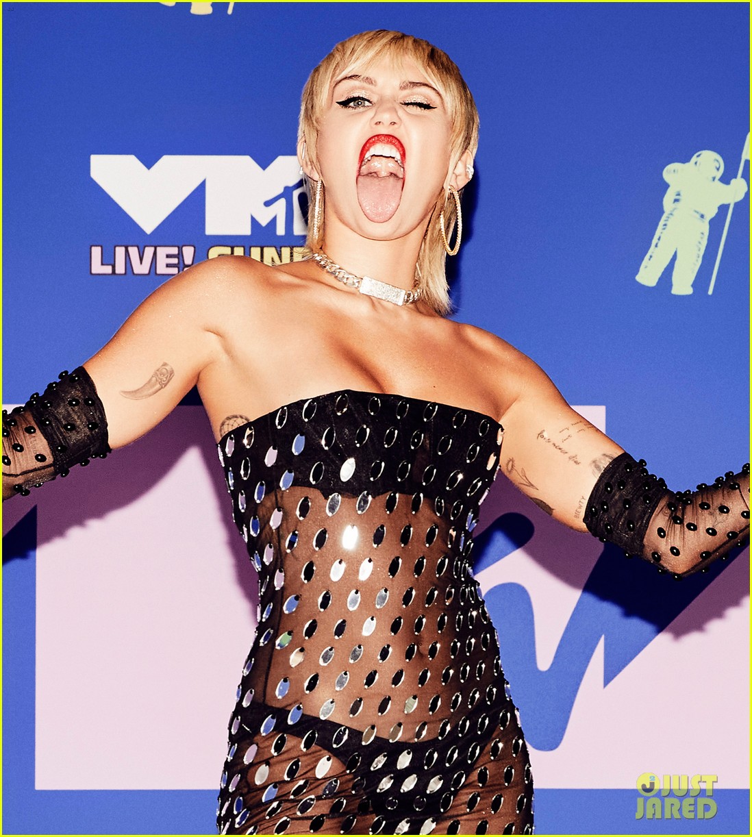 miley cyrus black sheer dress stuns fans in daring during New York album signing Non Exclusive: Miley Cyrus in