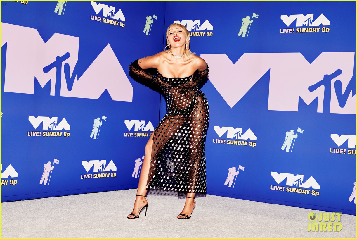 miley cyrus sheer dress Frees the Nipple in Black Gown Signing Miley Cyrus nearly puts it