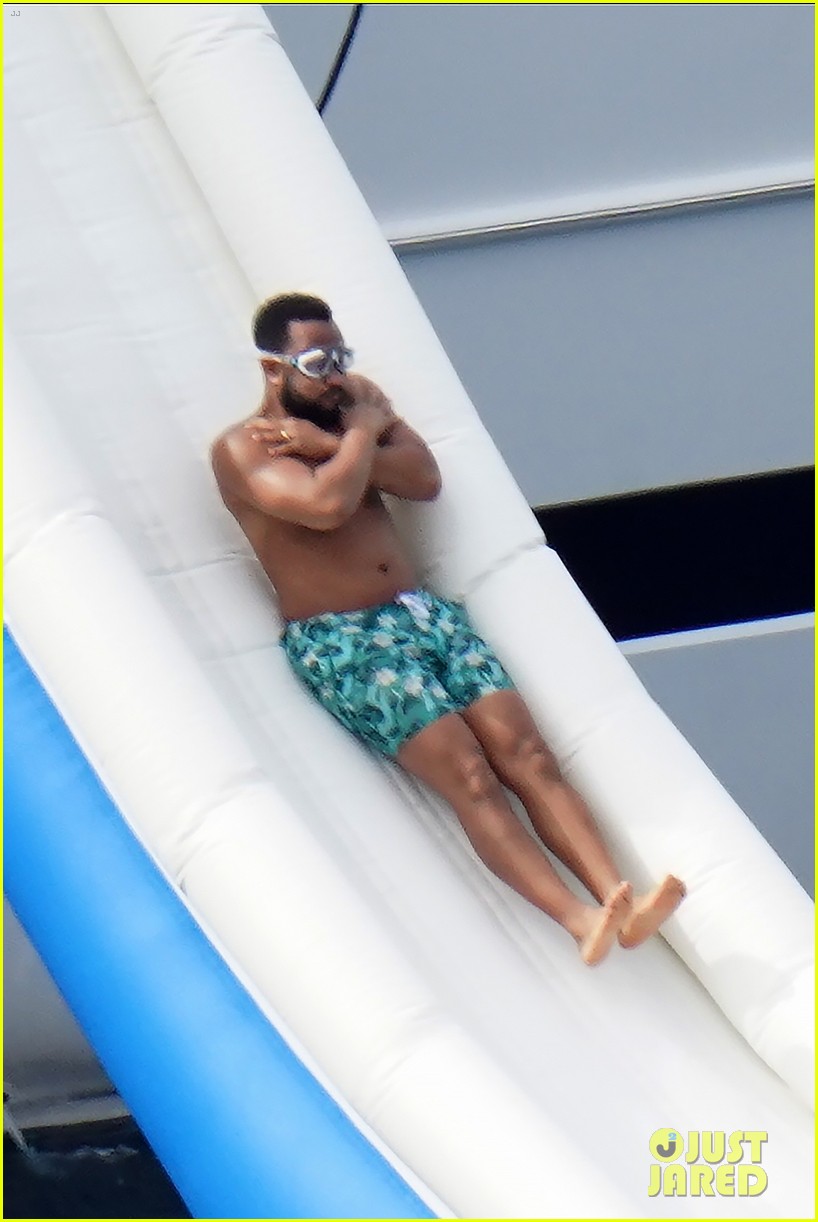 Shirtless John Legend Slides Down a Yacht During Family Vacation with Chrissy Teigen!