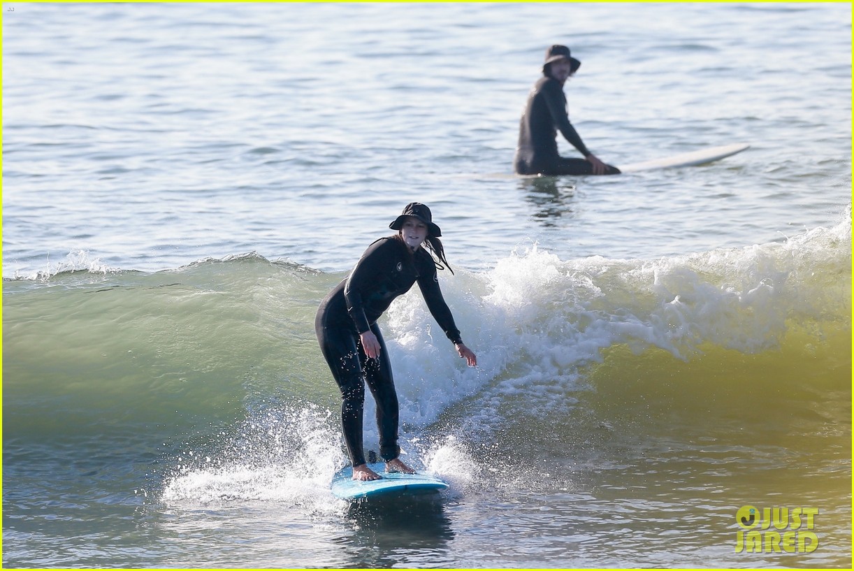 Leighton Meester & Adam Brody Adorably Hold Hands While Riding Their Surfboards in the Ocean