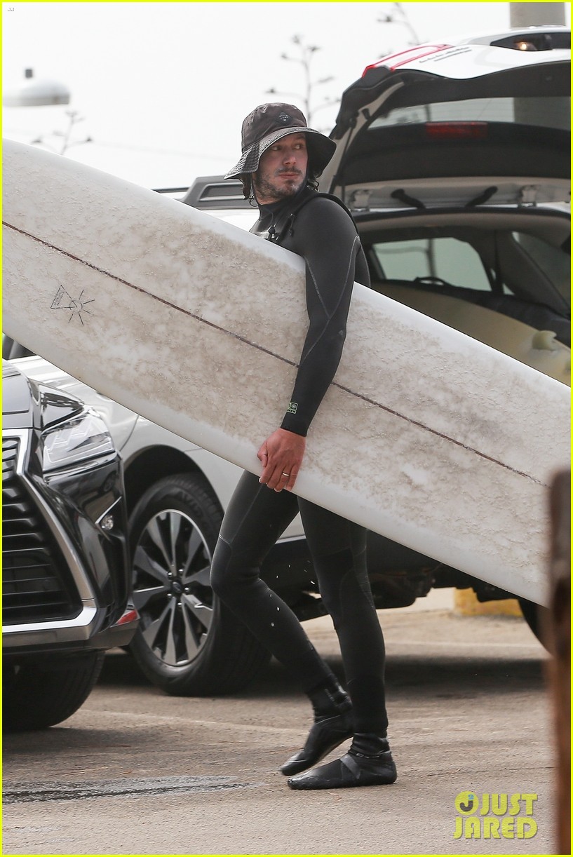Leighton Meester & Adam Brody Adorably Hold Hands While Riding Their Surfboards in the Ocean