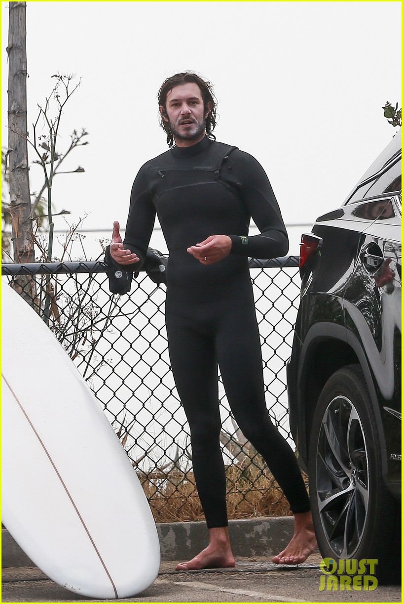 Leighton Meester & Adam Brody Adorably Hold Hands While Riding Their Surfboards in the Ocean