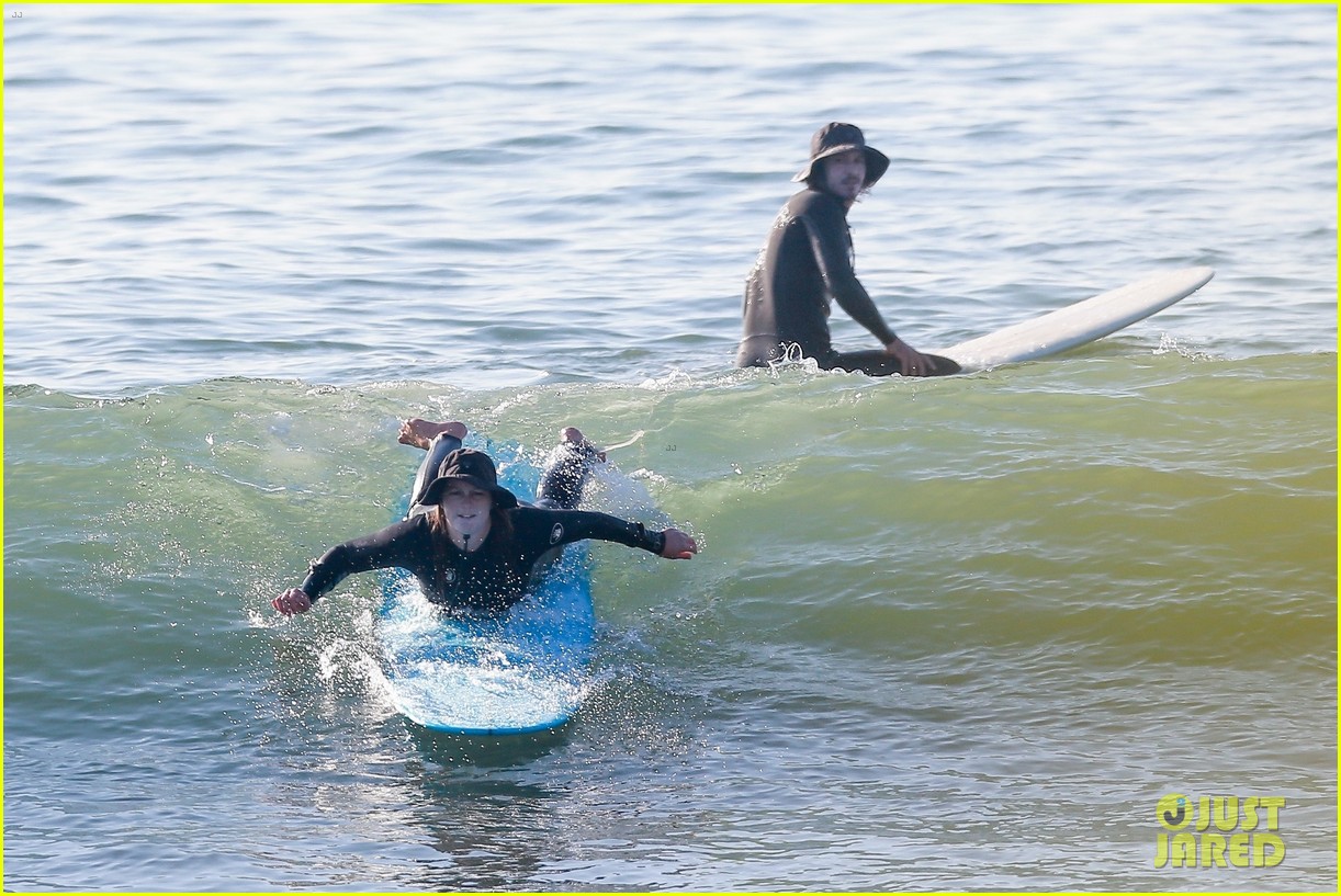 Leighton Meester & Adam Brody Adorably Hold Hands While Riding Their Surfboards in the Ocean