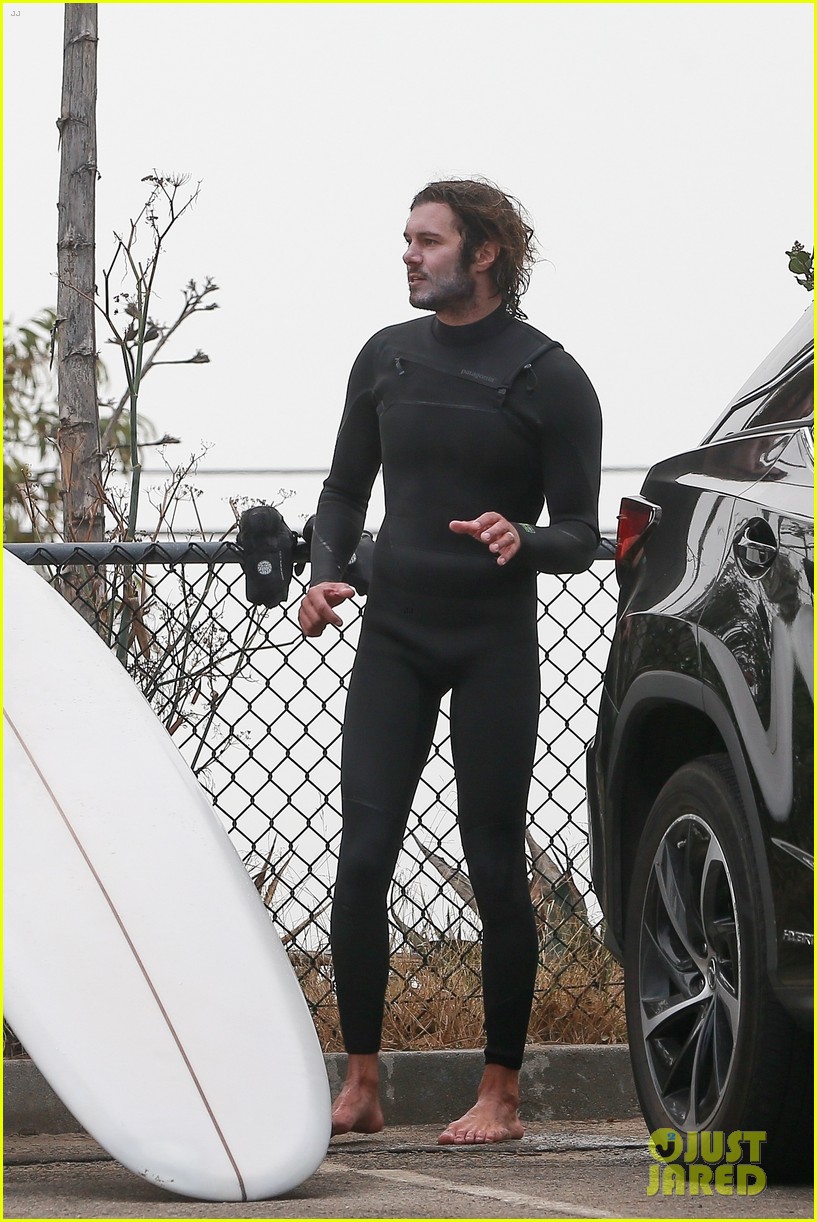 Leighton Meester & Adam Brody Adorably Hold Hands While Riding Their Surfboards in the Ocean