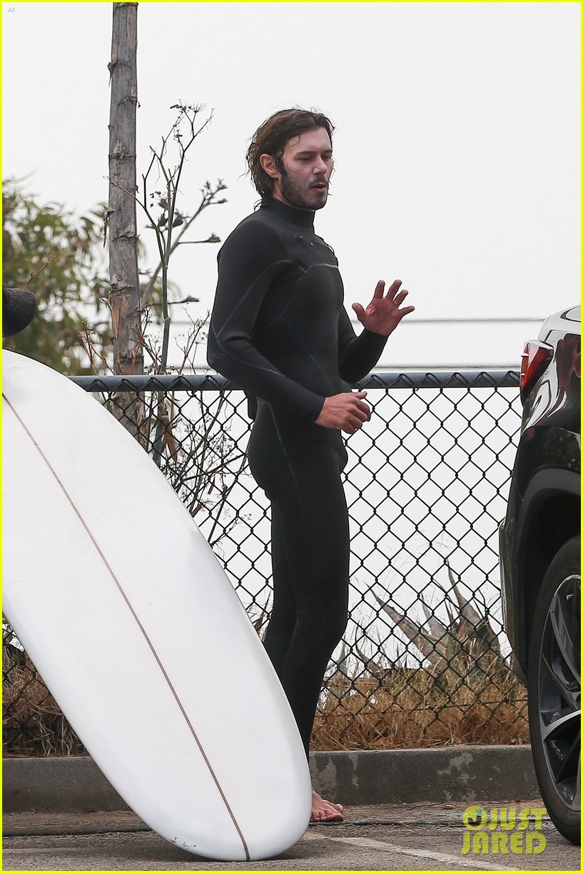 Leighton Meester & Adam Brody Adorably Hold Hands While Riding Their Surfboards in the Ocean