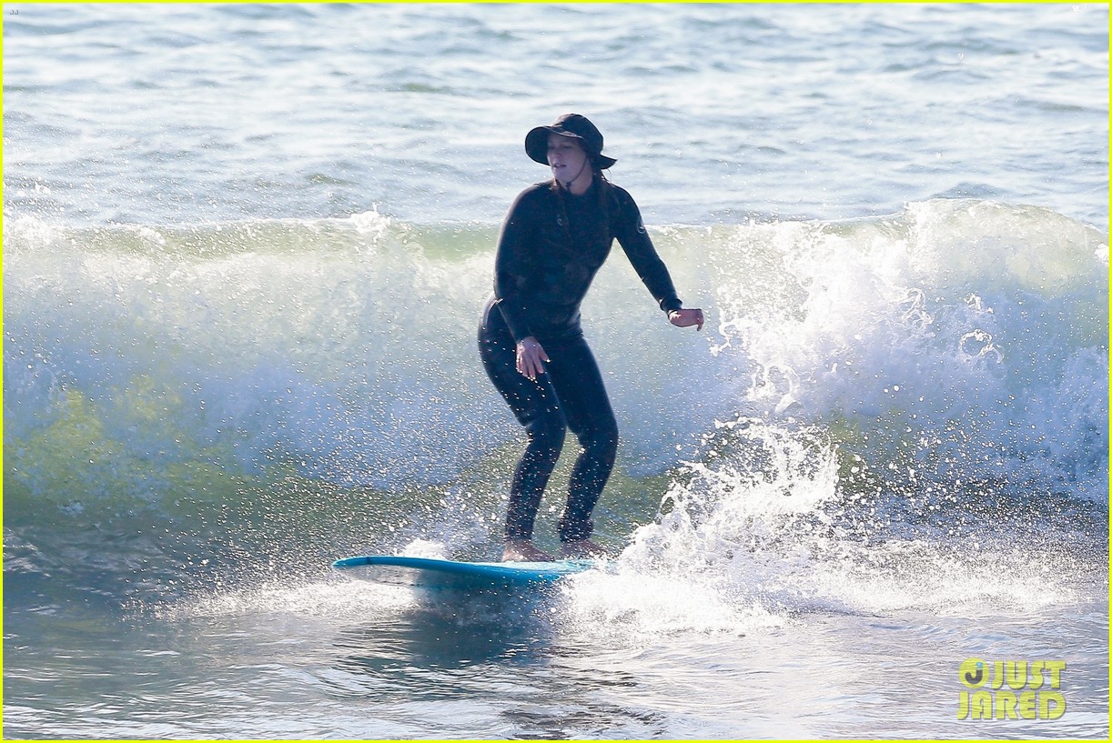 Leighton Meester & Adam Brody Adorably Hold Hands While Riding Their Surfboards in the Ocean