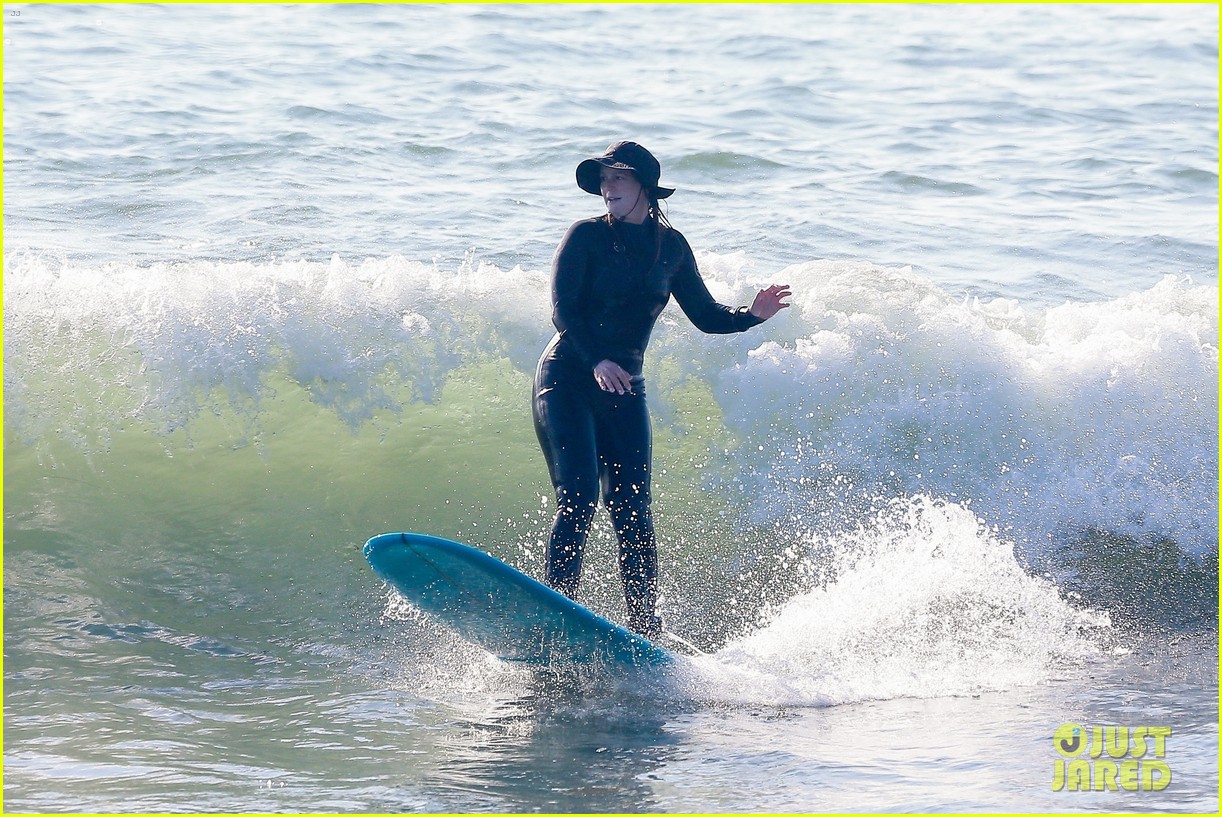 Leighton Meester & Adam Brody Adorably Hold Hands While Riding Their Surfboards in the Ocean