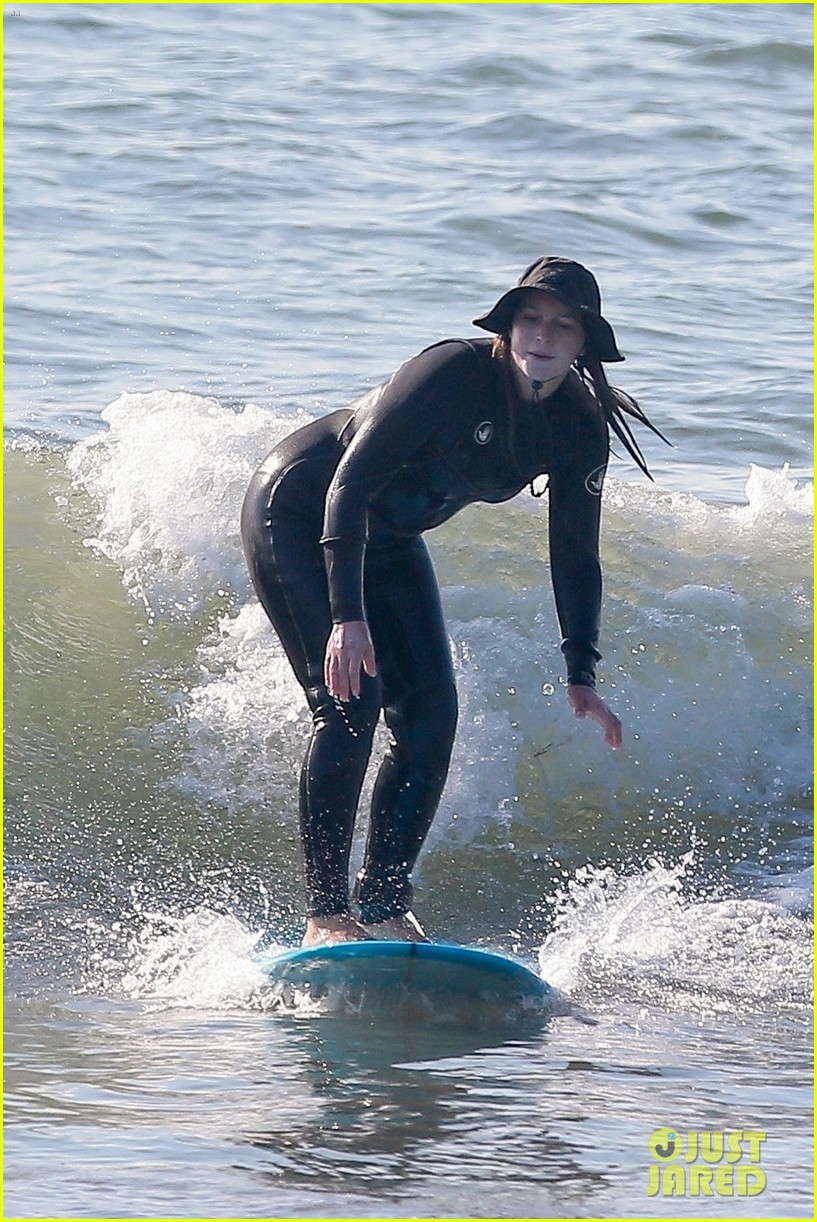 Leighton Meester & Adam Brody Adorably Hold Hands While Riding Their Surfboards in the Ocean