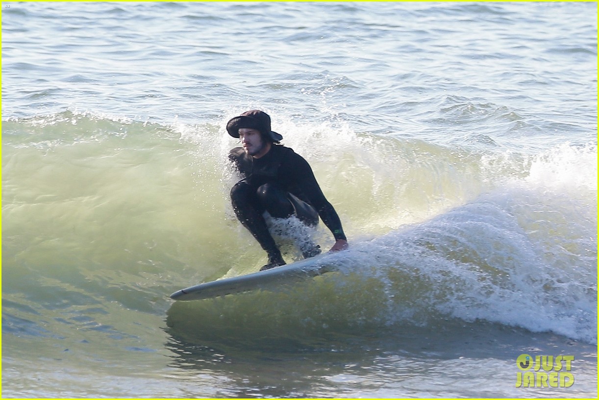 Leighton Meester & Adam Brody Adorably Hold Hands While Riding Their Surfboards in the Ocean