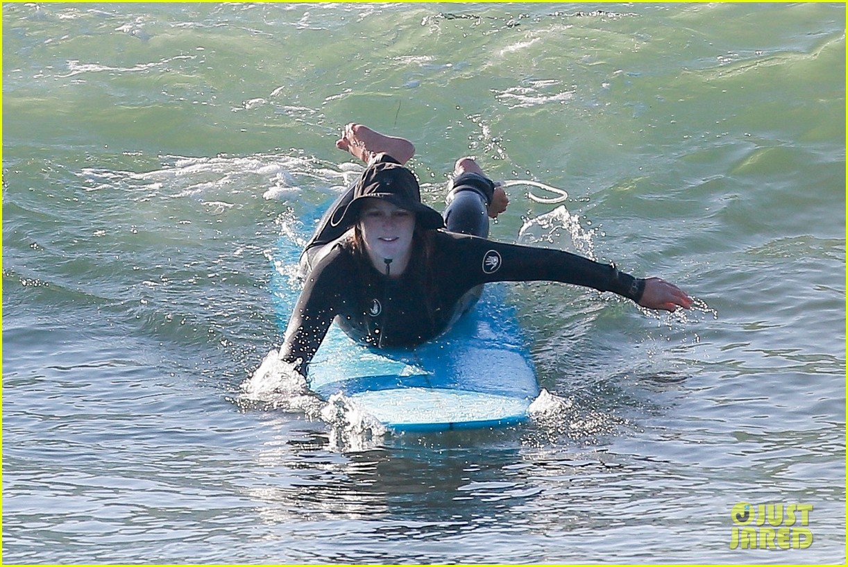 Leighton Meester & Adam Brody Adorably Hold Hands While Riding Their Surfboards in the Ocean