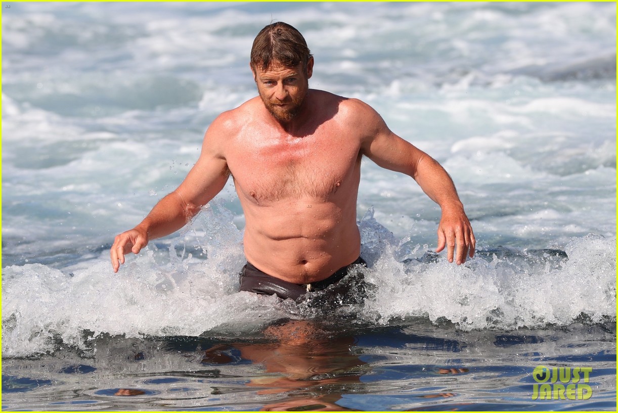 Simon Baker Goes Shirtless During Beach Day with 22-Year-Old Son Claude - See Photos!
