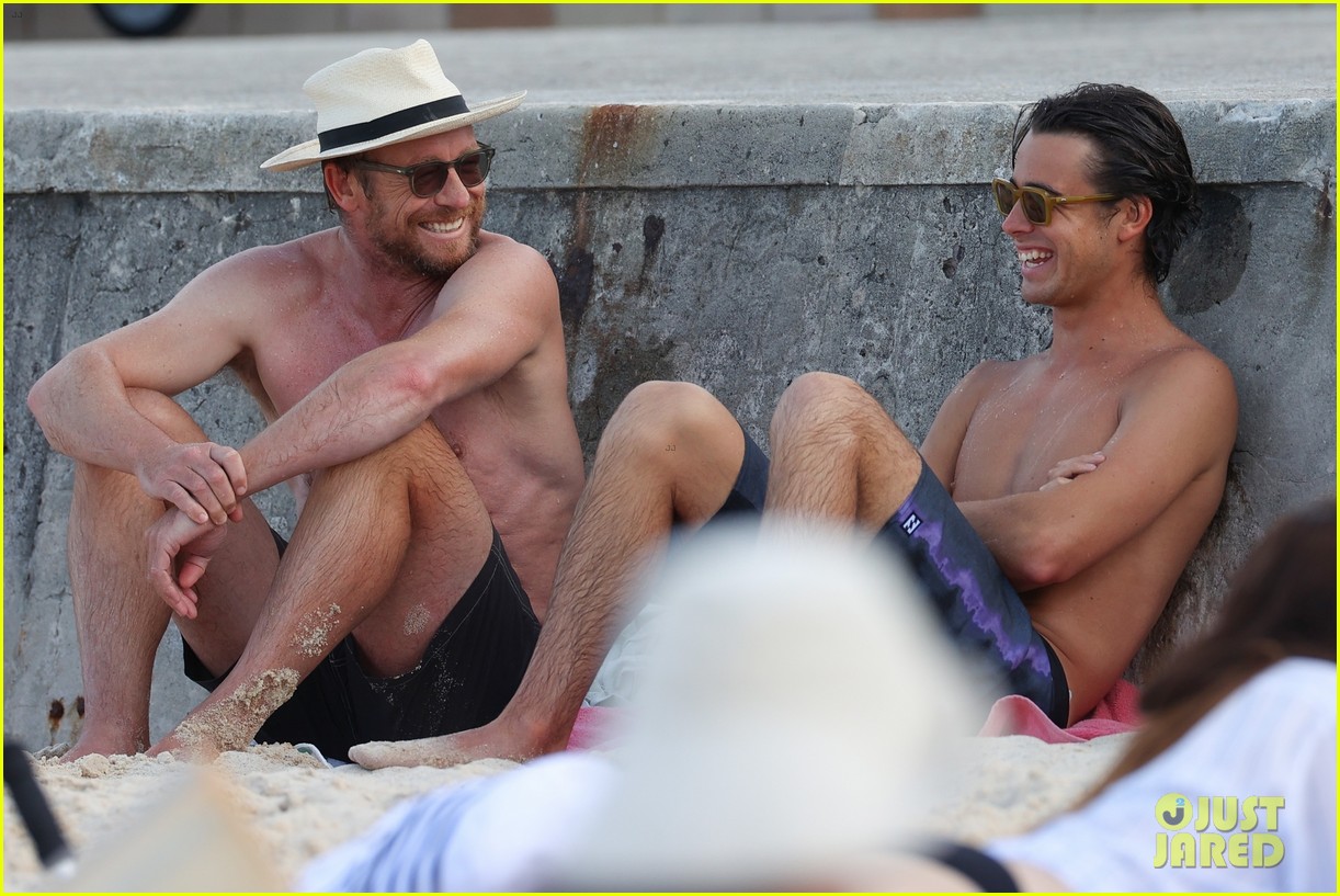 Simon Baker Goes Shirtless During Beach Day with 22-Year-Old Son Claude - See Photos!