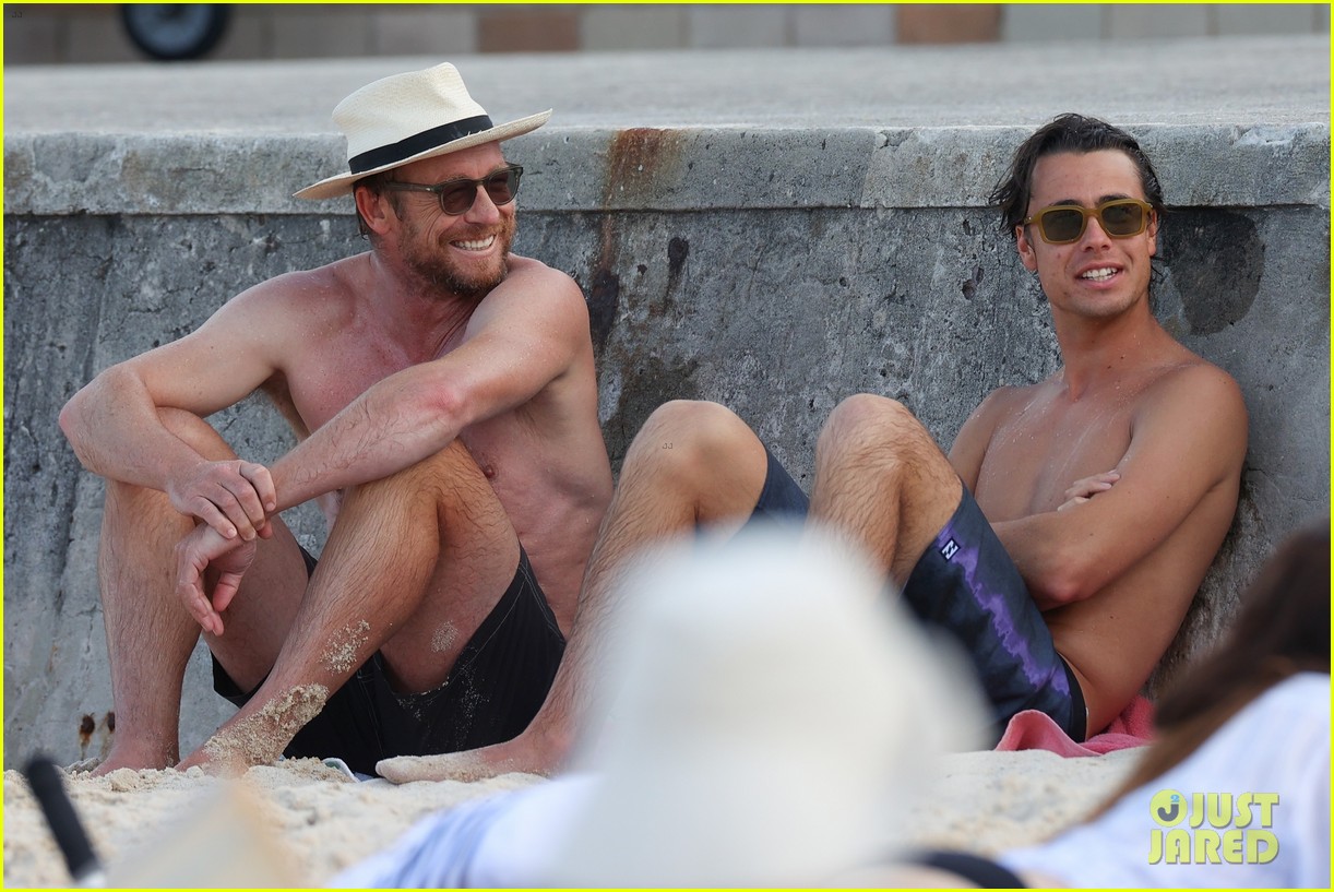 Simon Baker Goes Shirtless During Beach Day with 22-Year-Old Son Claude - See Photos!