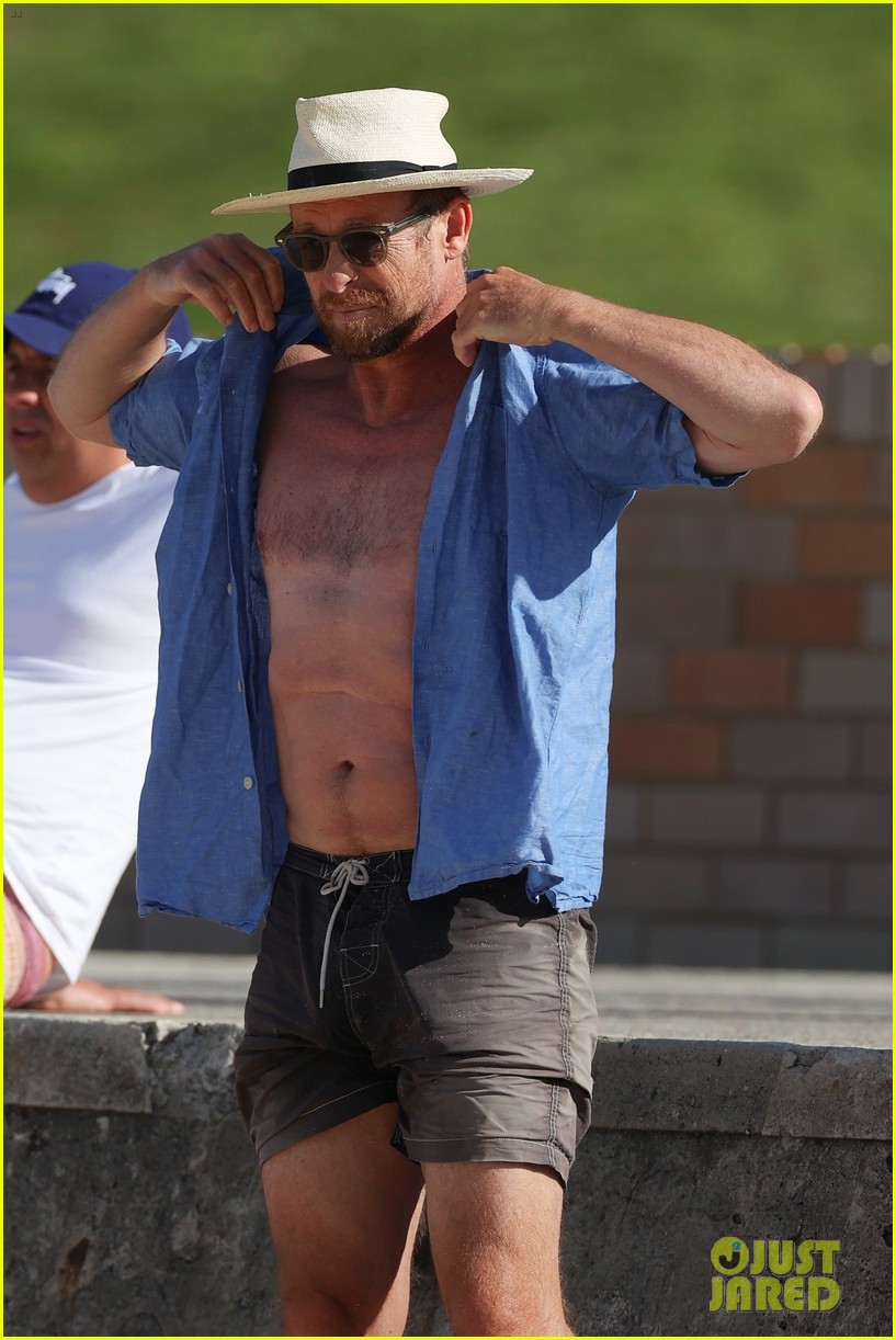 Simon Baker Goes Shirtless During Beach Day with 22-Year-Old Son Claude - See Photos!