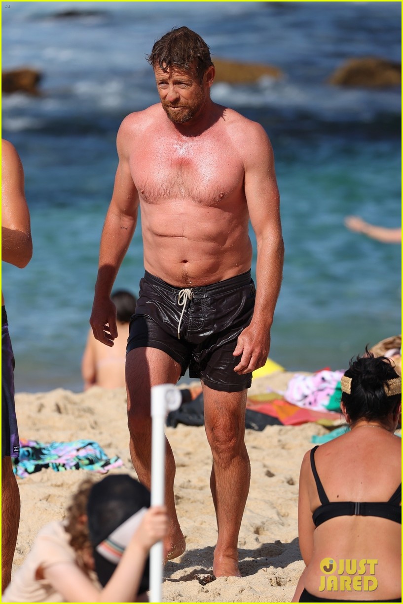 Simon Baker Goes Shirtless During Beach Day with 22-Year-Old Son Claude - See Photos!