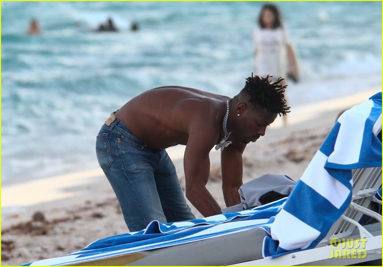 NFL Star Antonio Brown Channels Friend Kanye West While Going Masked at the Beach (Photos)