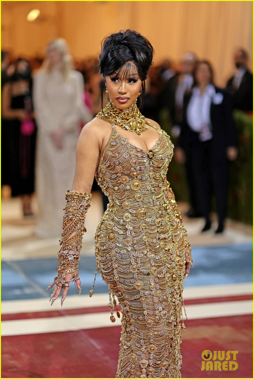 cardi b yellow dress red carpet Cardi B makes a Super Bowl 2026 halftime show cameo in a corset and  thigh-high gladiator heels