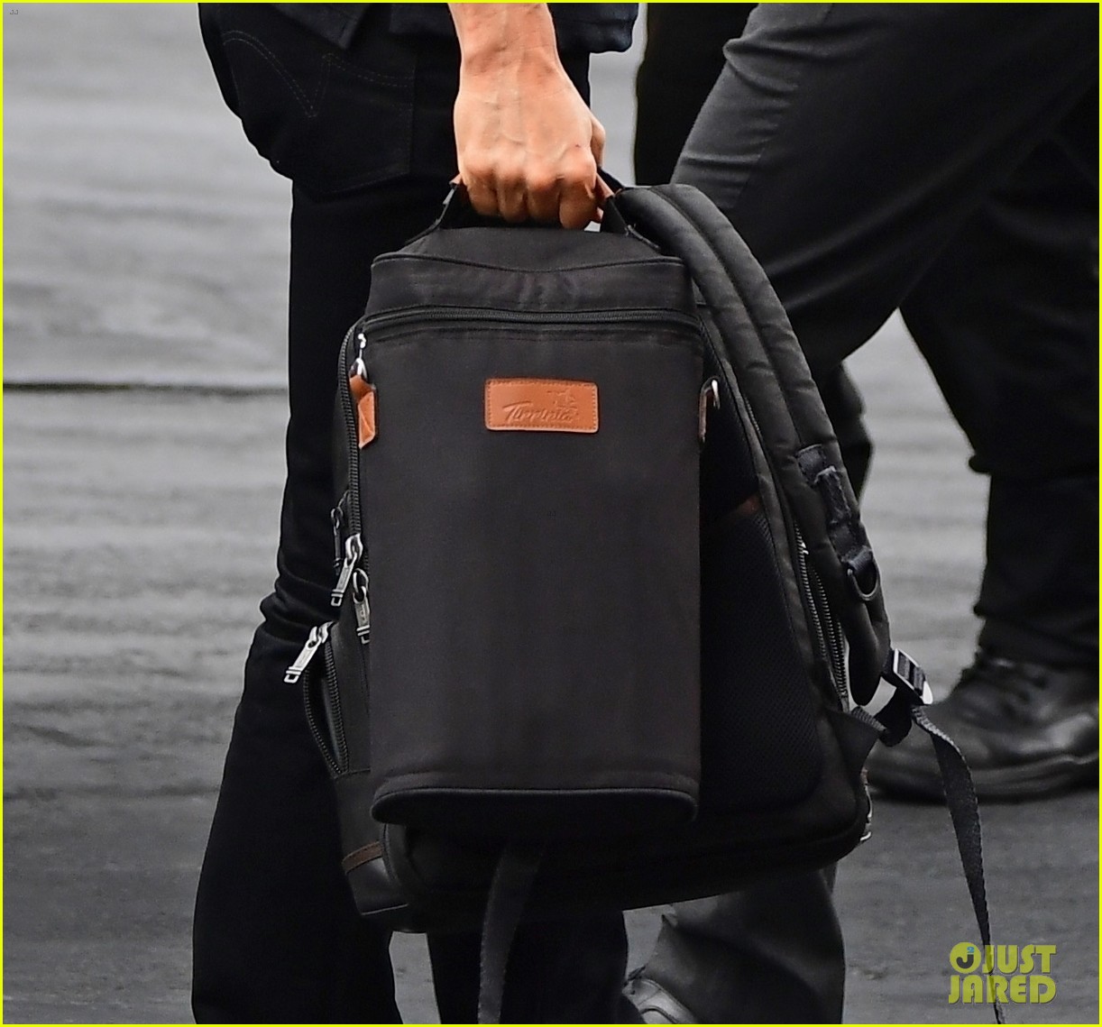 tom cruise tumi backpack Tom Cruise Arrives Back in London While 'Top Gun 2' Is Possibly Returning  to #1 at the Box Office! - Just Jared - Celebrity News and Gossip