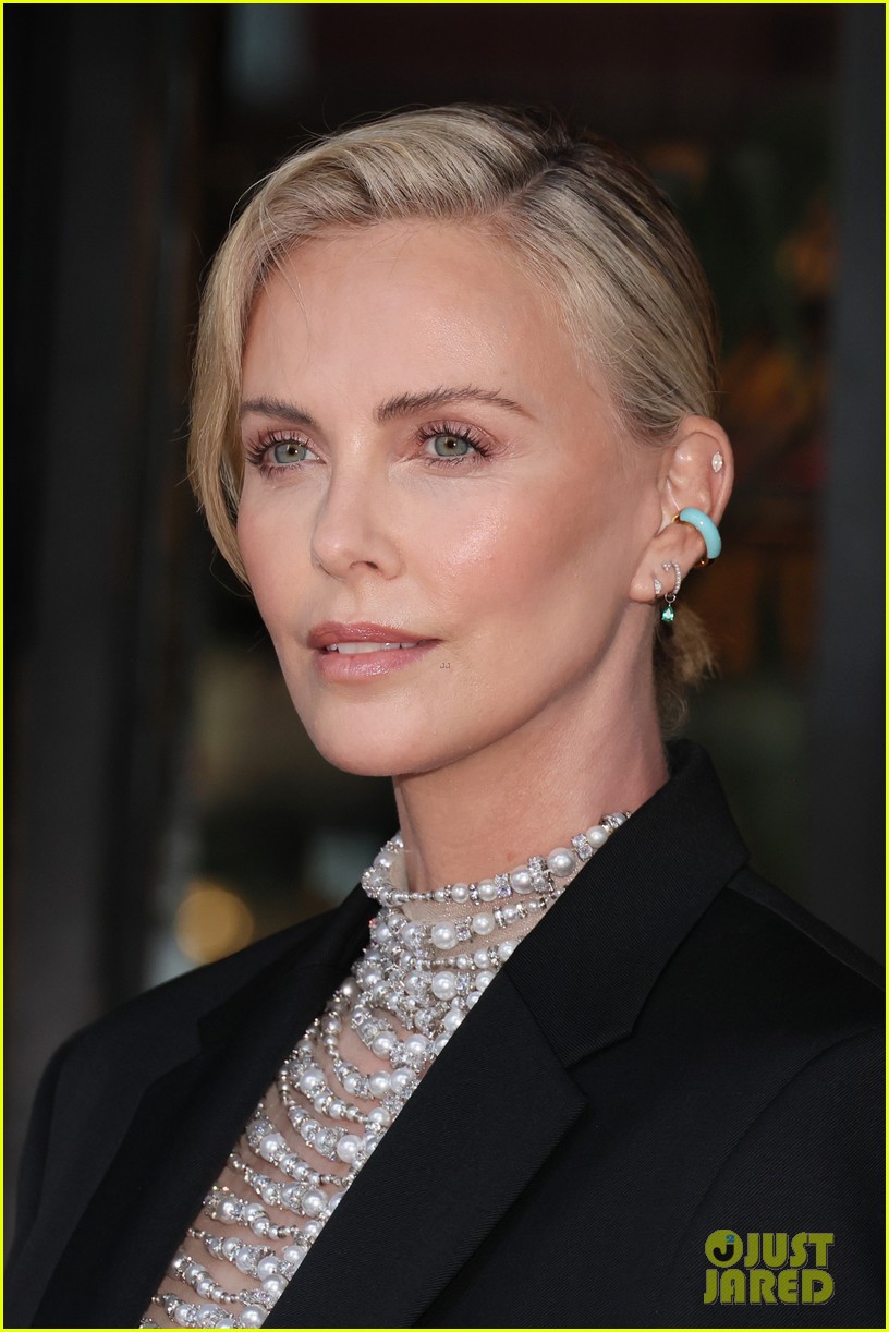 Charlize Theron Wears A Daring Pearl Top For Breitling's Boutique Opening in NYC