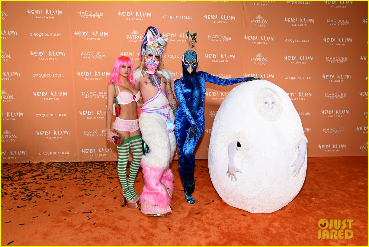 Heidi Klum Dresses as Peacock with Acrobats as Her Feathers for Halloween Party 2023!