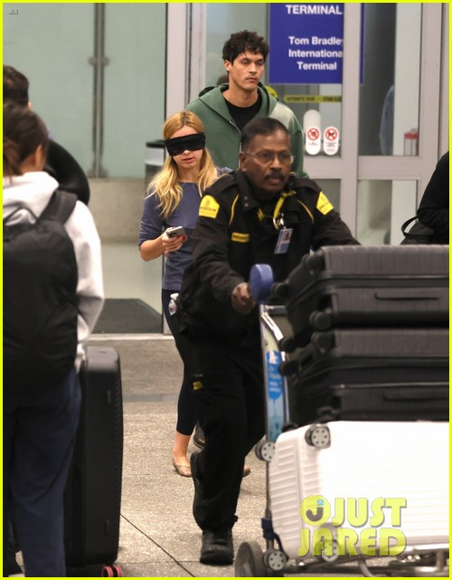 Addison Rae Wears Blindfold at LAX Airport With Basketball Player Addison Owen