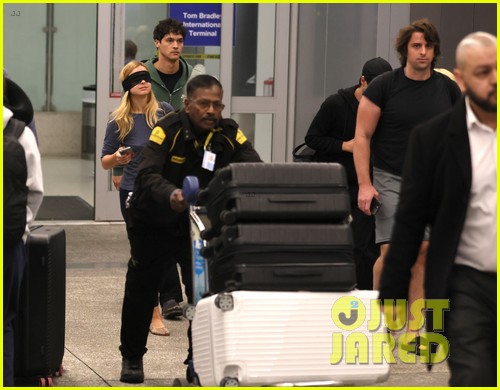 Addison Rae Wears Blindfold at LAX Airport With Basketball Player Addison Owen