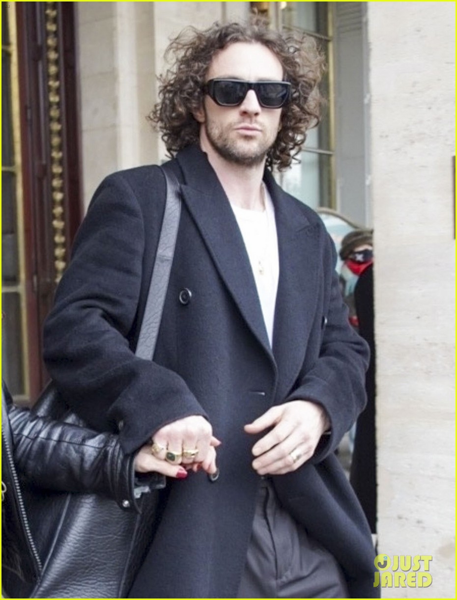 Aaron Taylor-Johnson & Wife Sam Hold Hands as They Check Out of Paris Hotel
